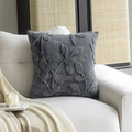 Modern charcoal grey plush throw pillow cover with 3D leaf pattern on a white sofa - 18x18 Inch / Space Gray