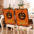 Detailed close-up of two orange Halloween pumpkin chair covers with Happy Halloween text - Orange Happy Halloween Style (YT56-16) / 1 Piece/Pack (49x58cm)