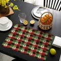 Detailed close-up of red and green plaid Christmas placemat on a dark wooden table texture - Scottish Tartan (CD46-12)