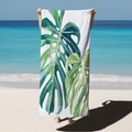 Microfiber beach towel with green monstera leaf print held by a model on a sunny tropical beach - White Monstera Leaf (STJ02-15) / 70*140cm