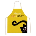 Detail of yellow cotton apron featuring a cute black cat and Happy Caturday slogan - Yellow Black Cat Happy (WQ06-18)