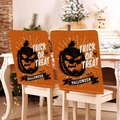 Set of 2 orange Halloween chair covers featuring black pumpkin silhouettes and text - Orange Trick or Treat Style (YT56-20) / 1 Piece/Pack (49x58cm)