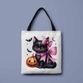 Detail of canvas tote bag featuring a cute black cat and orange Halloween pumpkin print - Black Cat Jack-O'-Lantern (FBDT01-37)