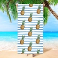 Detail showing the soft microfiber texture of blue striped beach towel with yellow pineapples - Pineapple Striped Pattern (STMJ03-6)