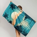 Microfiber beach towel with sunset palm tree print being held by a model - Tropical Sunset Palm Trees (STMJ02-2)