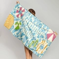 Microfiber beach towel with blue wave print and summer elements held by a model - Summer Sale Theme (STMJ02-5)