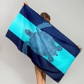 Microfiber beach towel featuring a large blue sea turtle print and striped design - Spliced Blue Base Large Turtle (STMJ01-11)