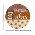 Round autumn wooden wall decor featuring Pumpkin Spice design with coffee cup and orange pumpkins - Round