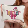 Close-up of the teacher-themed canvas cosmetic bag held by hand to show portable size - Angel Teacher Print (TSND25-11) / 21.5*15cm