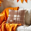 Detail view of plaid Hello Fall cushion cover on white sofa with orange blanket - Plaid Hello Fall Floral (DYM379-3) / 45*45cm Cover Only