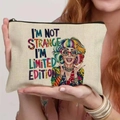 Beige canvas makeup bag with I'M NOT STRANGE slogan and pop art illustration - 21.5x15cm / Limited Edition (THZB18-7)