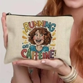 Cream canvas cosmetic bag with Running on Caffeine quote held by a model - 21.5x15cm / Running on Caffeine (THZB18-20)