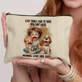 Beige canvas makeup bag featuring funny quote and illustration held by a model - 21.5x15cm / Don't Make Mommy Angry (THZB18-22)