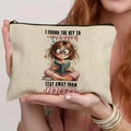 Beige canvas cosmetic bag with humor quote and girl reading illustration - 21.5x15cm / Stay Away from Idiots (THZB18-23)