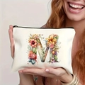 White canvas makeup bag with floral letter M design and secure black zipper closure - Letter M (TSND27-13) / 21.5x15cm