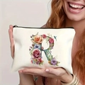 Beige floral canvas makeup bag with letter R embroidery held by female hands - Letter R (TSND27-18) / 21.5x15cm
