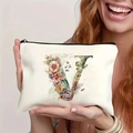 Off-white canvas makeup bag with watercolor floral letter V and black zipper detail - Letter V (TSND27-22) / 21.5x15cm