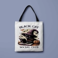 White Halloween canvas tote bag with black cat wizard print and social club text - Bookish Black Cat Club (FBDT01-24)