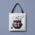 White canvas tote bag with black handles featuring a cute witch cauldron print - Pink Bow Cauldron (FBDT01-34)