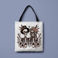 White canvas tote bag with black handles featuring a skull couple and We Are Happy text - We Are Happy Skeleton (FBDT01-41)