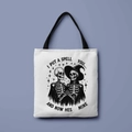 White Halloween canvas tote bag with black skeleton witch print and I Put A Spell text - Spell on Him Skeleton (FBDT01-44)