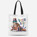 Chic cream canvas tote bag featuring a colorful Booked and Busy graphic design - Booked and Busy(TFBD26-1)