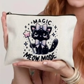 Canvas makeup bag with magic cat print and meow mode text held by a model - Magic Cat (TSND71-7) / 21.5x15cm