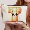 Handheld cream canvas makeup bag featuring orange plaid cartoon mushroom illustration - 21.5x15cm