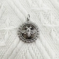Silver bee charm pendant with sparkling cubic zirconia on white woven background - Bee (NAB02-5)