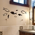 Detailed view of black 3D acrylic mirror fish wall stickers in a modern home interior - Black