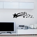 Detalle de vinilos decorativos de estrellas y cometa de acrílico negro en un salón - Negro