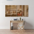 Detailed view of 8-piece square acrylic mirror wall stickers in a modern living room setting - Brown