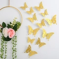 Set of 12 gold 3D hollow butterfly wall stickers with intricate floral texture patterns - Gold (Style E)