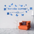 Detail of 3D blue acrylic mirror butterfly wall stickers with 'Her Vibe is Pretty' slogan - Blue