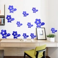 Detalle de los adhesivos de pared de espejo acrílico de girasol azul con superficie reflectante - Azul