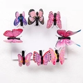 Set of 8 colorful artificial butterfly hair clips with realistic patterns on a white card - Pink