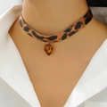 Close-up of leopard print fabric choker featuring a heart-shaped amber resin pendant - Leopard Fabric/Resin / Leopard Resin Heart Style (S397)