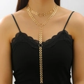 Detail of gold layered Y-necklace with rectangular links and circular ring on a model - Multi-layer Y-Necklace (Gold)