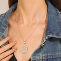 Silver radiant round pendant necklace with rectangular zircon worn by a female model - Silver Round Radiant Necklace (WG-1004)