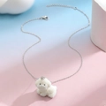 Close-up of cute white flocked resin dog pendant on a silver-tone metal chain necklace - 3D White Puppy (02 White K A-1216)