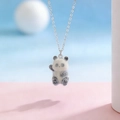 Detailed view of a cute fuzzy panda pendant necklace with a delicate silver chain - Waving Sitting Panda (01 White K A-1215)