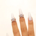 Detailed view of silver copper nail rings with zircons on elegant long white nails - V-Shape Nail Ring / 2-Piece Set / Silver