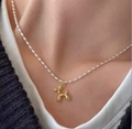 Fashionable golden balloon dog pendant on a silver beaded necklace for women - Gold Balloon Dog Rice Bead Chain (07 kc Gold 3318)