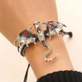 Detailed close-up of woven dragon bracelet with silver dragon wing and red zircon stones - Woven Bracelet (H-107) / Grey Black
