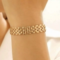 Chic triple-row interwoven oval link bracelet in gold finish worn on female wrist - KC Gold Triple Row Bracelet (3877)