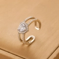 Detail of vintage heart zircon ring featuring double-layer band and sparkling pavé stones - White Gold Color