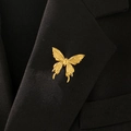 Elegant gold butterfly brooch pinned on a black suit lapel with detailed wing texture - Dynamic Butterfly Style (6250)