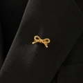 Elegant matte gold bow brooch pinned on black suit lapel for a sophisticated look - Minimalist Bowknot Style (8186)