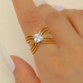 Golden irregular tiered ring with a square zircon gemstone worn by a model - Multi-layer Woven Square Zircon Gold Style (9168)