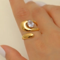 Gold plated stainless steel wrap ring with oval zircon on model finger - Non-closed Oval Zircon Gold Style (9174)